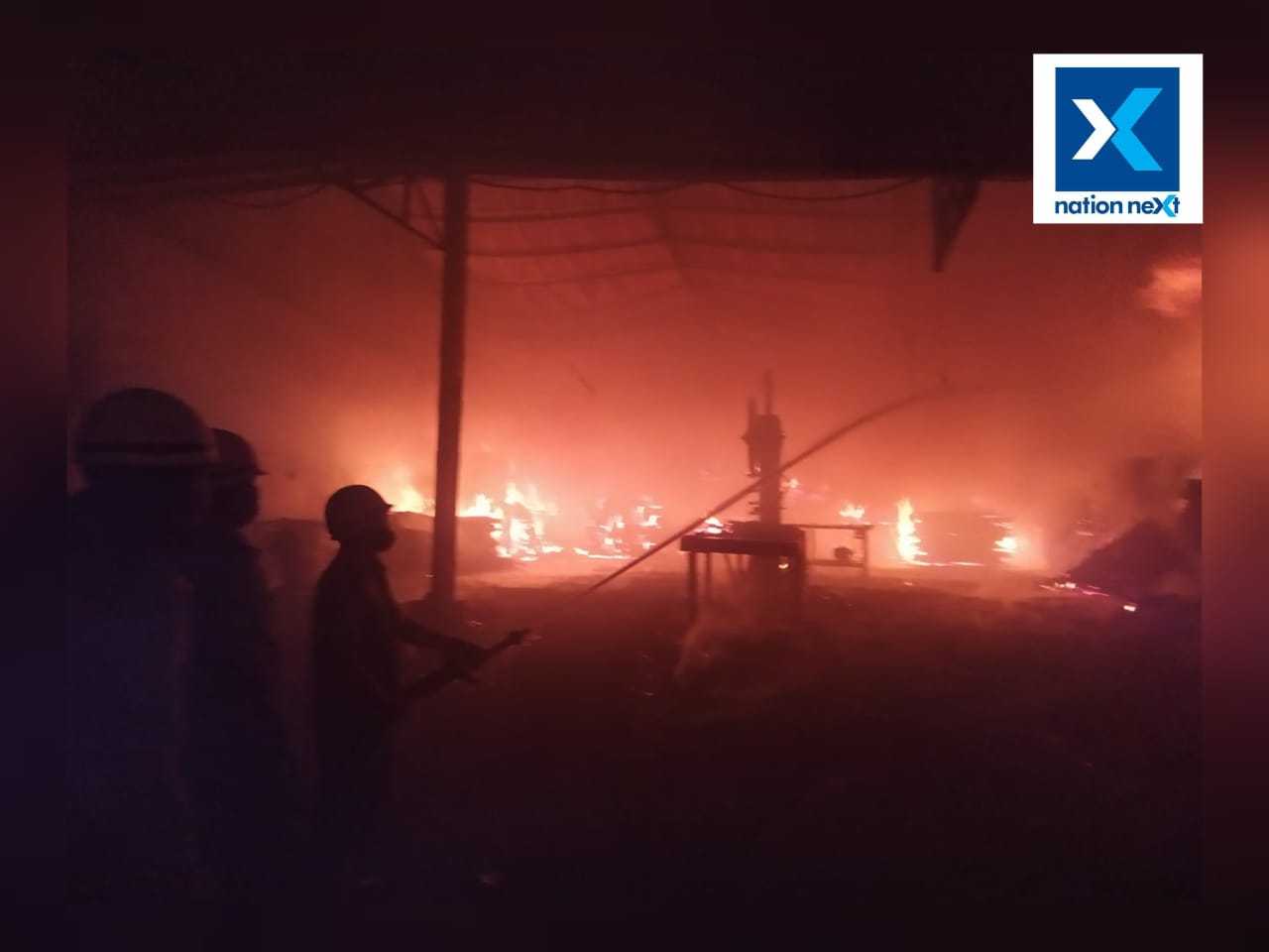 Firemen try to douse the fire at the saw mill in Nagpur 